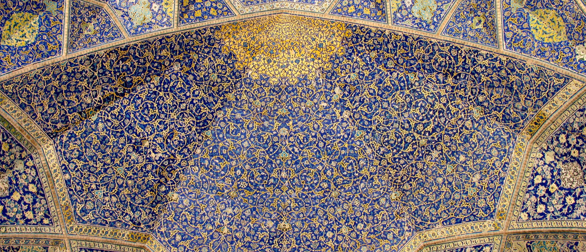 Blue intricates tiles in Iranian Islamic architecture in Isfahan, Iran