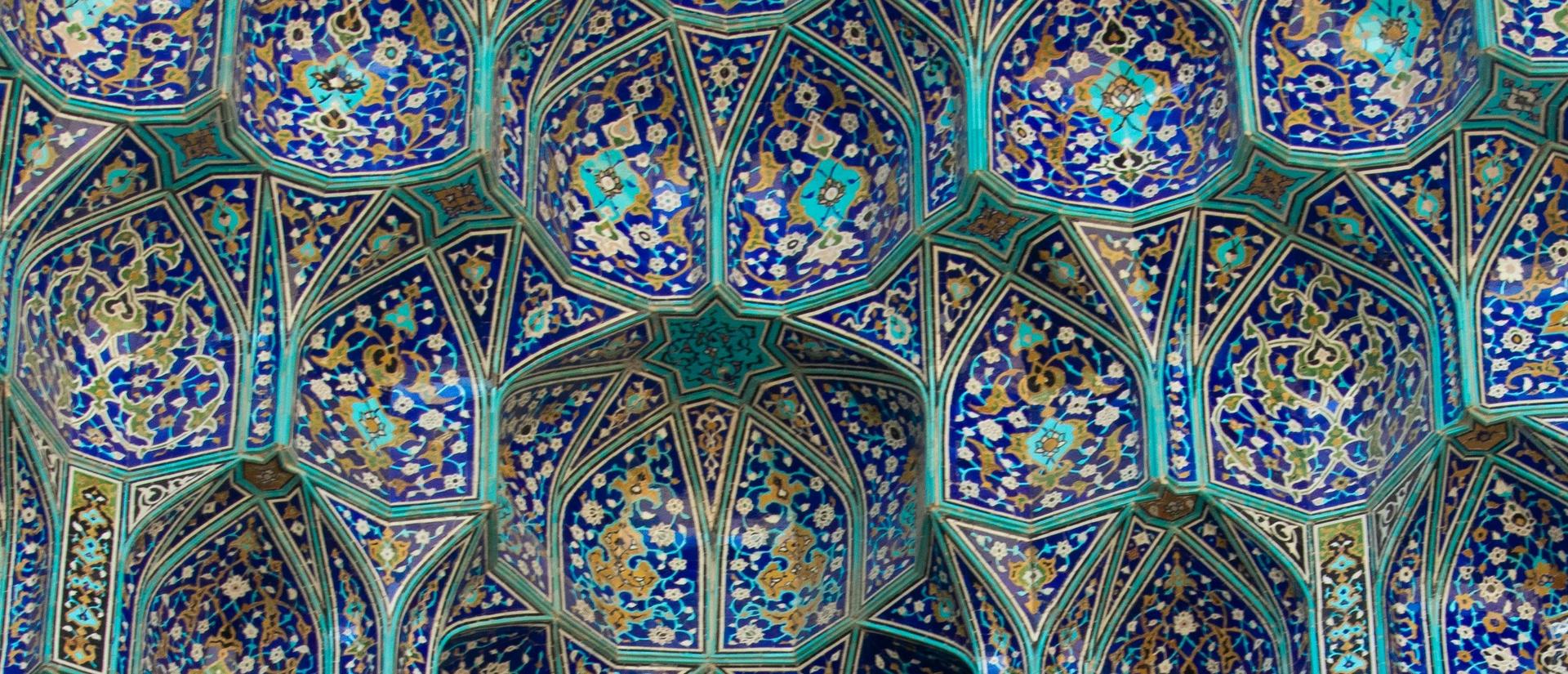 Blue intricates tiles in Iranian Islamic architecture in Isfahan, Iran