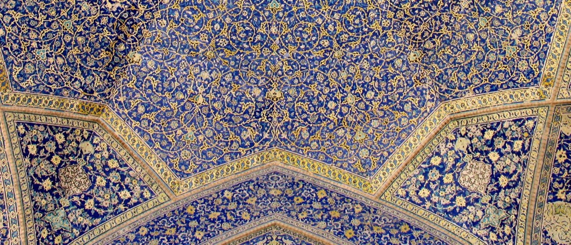 Blue intricates tiles in Iranian Islamic architecture in Isfahan, Iran