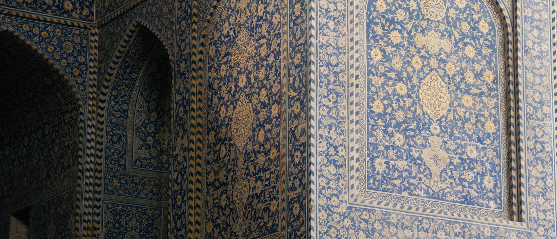 Blue intricates tiles in Iranian Islamic architecture in Isfahan, Iran