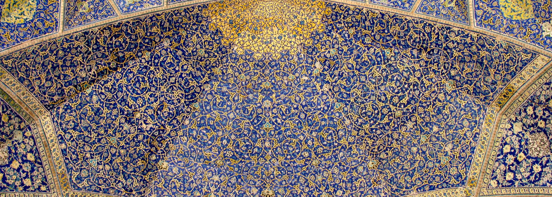 Blue intricates tiles in Iranian Islamic architecture in Isfahan, Iran